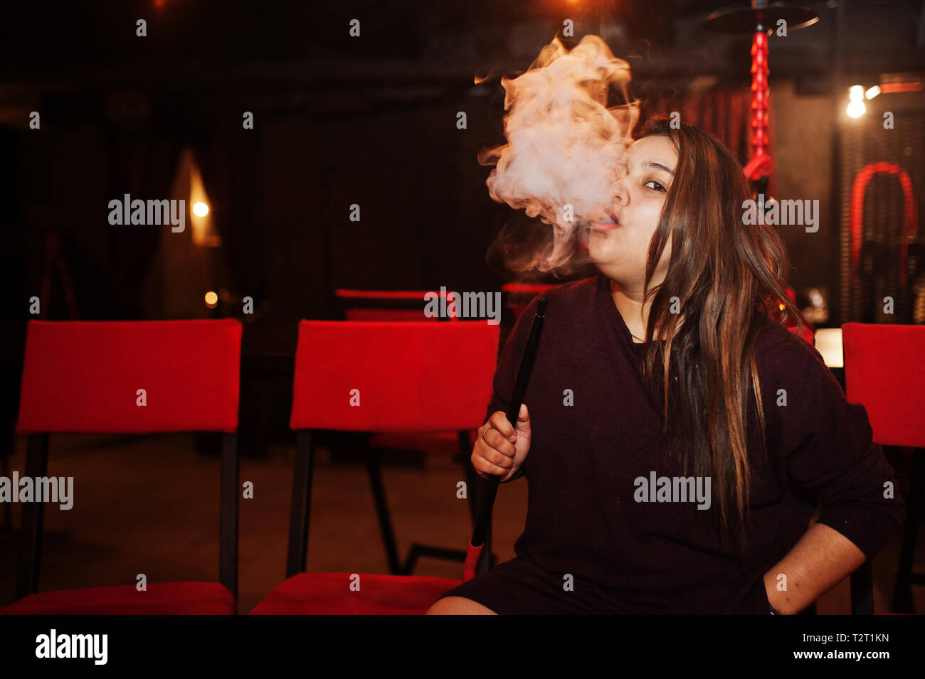 Asian girl smoke hookah at lounge bar Stock Photo Alamy