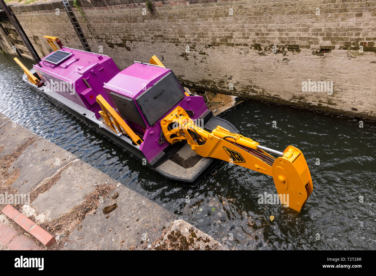 Specially adopted JCB digger in Stroudwater Navigation canal, Stroud, Gloucestershire, UK Stock Photo
