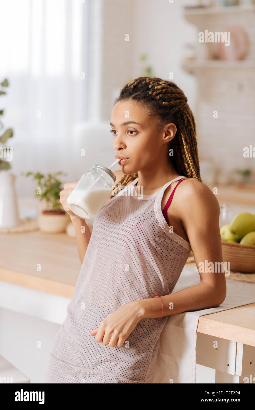Protein shake. Woman leading healthy lifestyle wearing sport clothes