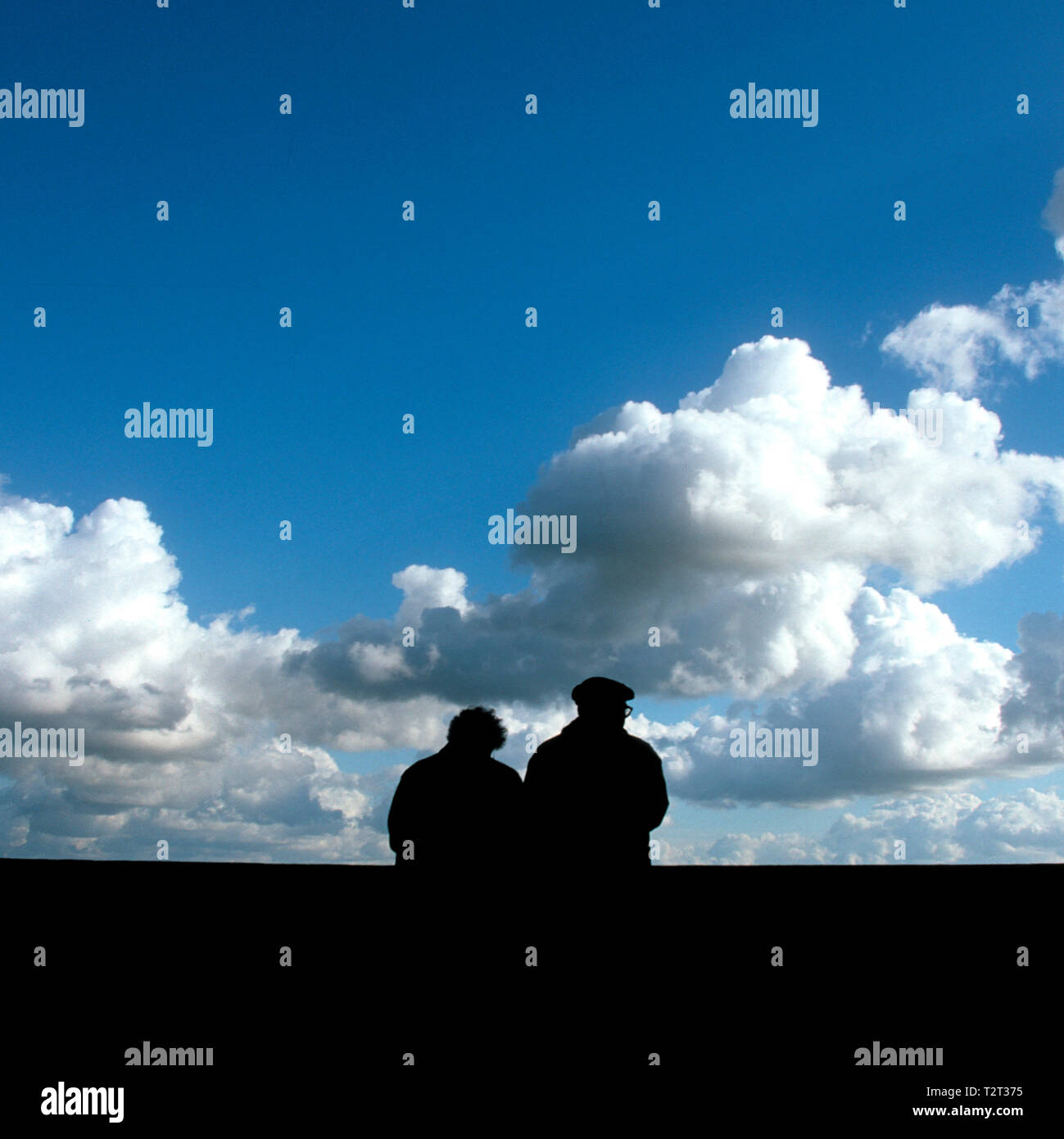 Silhouettes of a retired couple of backs Stock Photo