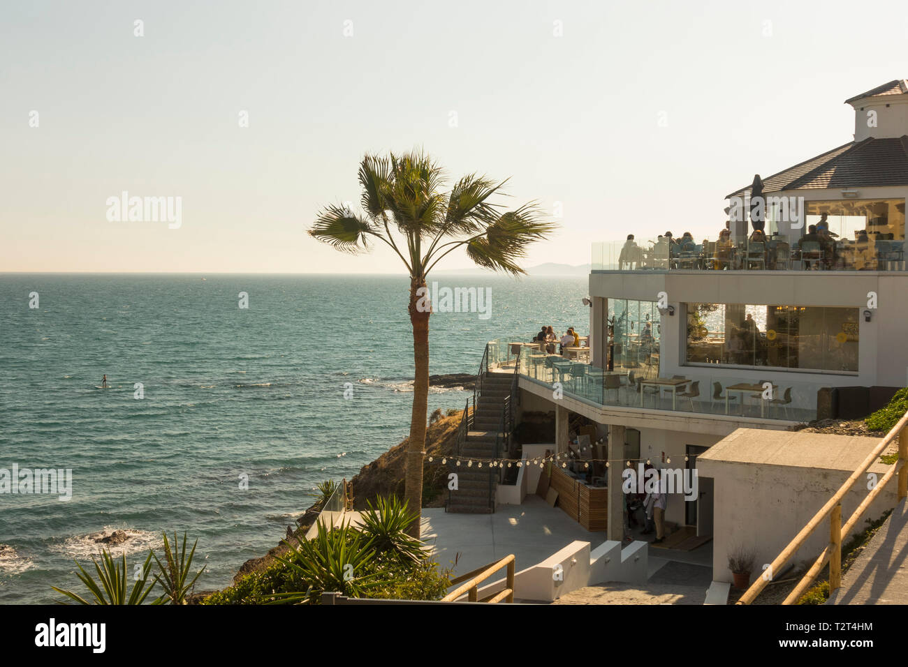 Beach bar, People sitting high level terrace overlooking the
