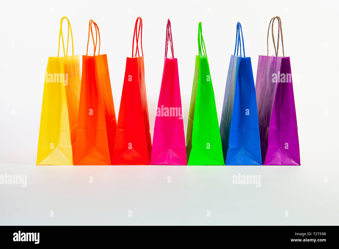 Set of colorful empty shopping bags isolated on the white background ...