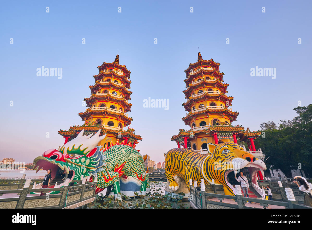 Kaohsiung, Taiwan - December 3, 2018: People come to merit at Cih Ji Dragon and Tiger Pagodas on lotus pond in sunset time at Zuoying district, Kaohsi Stock Photo