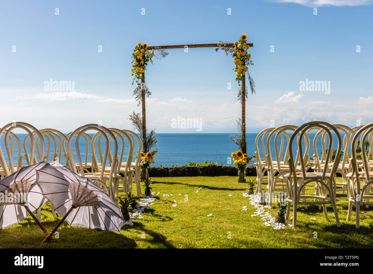Wedding Arch For A Ceremony Decorated With Tropical Flowers And White wedding-arch-for-a-ceremony-decorated-with-tropical-flowers-and-white