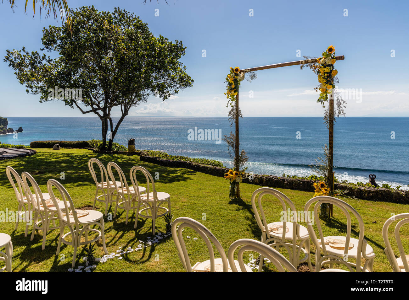 Wedding Arch For A Ceremony Decorated With Tropical Flowers And White wedding-arch-for-a-ceremony-decorated-with-tropical-flowers-and-white