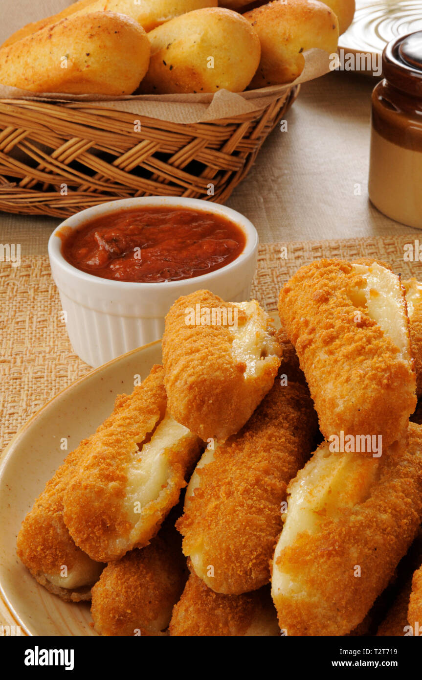 a plate of deep fried breaded mozzarella cheese sticks Stock Photo Alamy