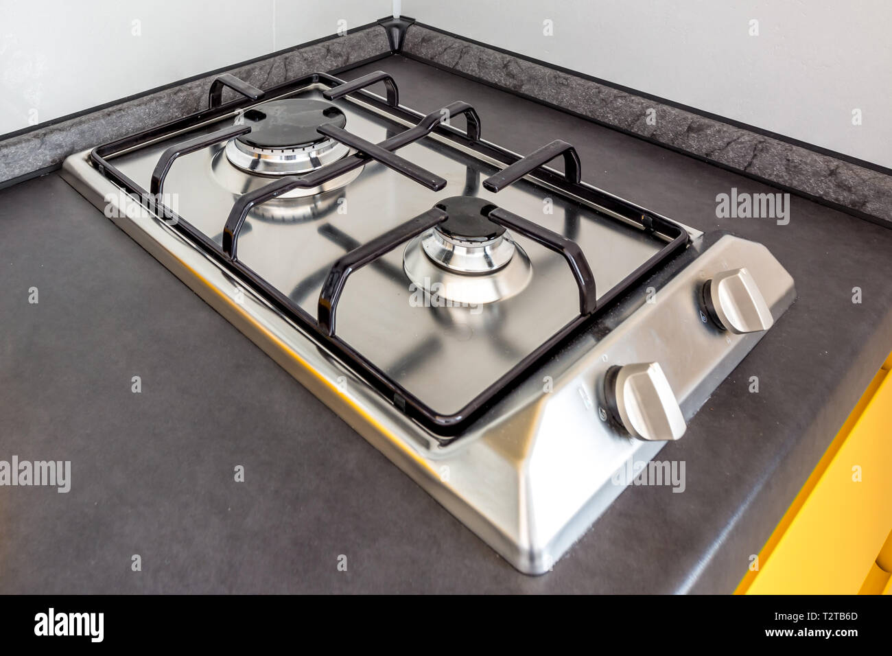 gas stove cooker on two burners in the kitchen Stock Photo Alamy