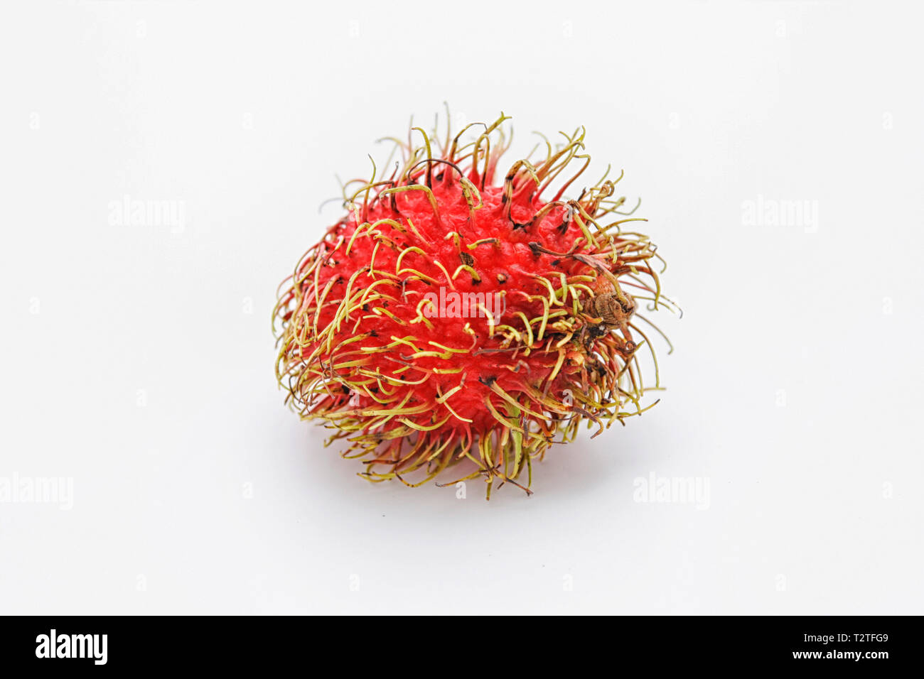 Asian fruit with hairy exterior but sweet interior Stock Photo