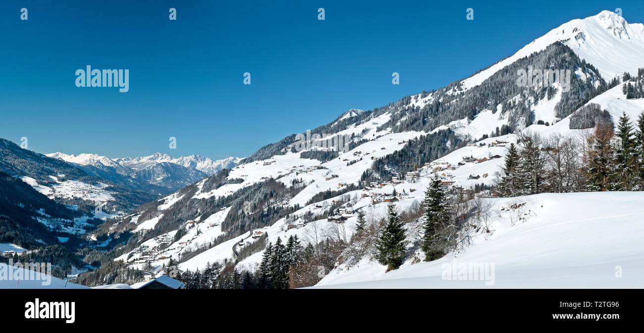 Austria, Biosphere Park Grosses Walsertal,  Fontanella village and the valley covered with snow Stock Photo