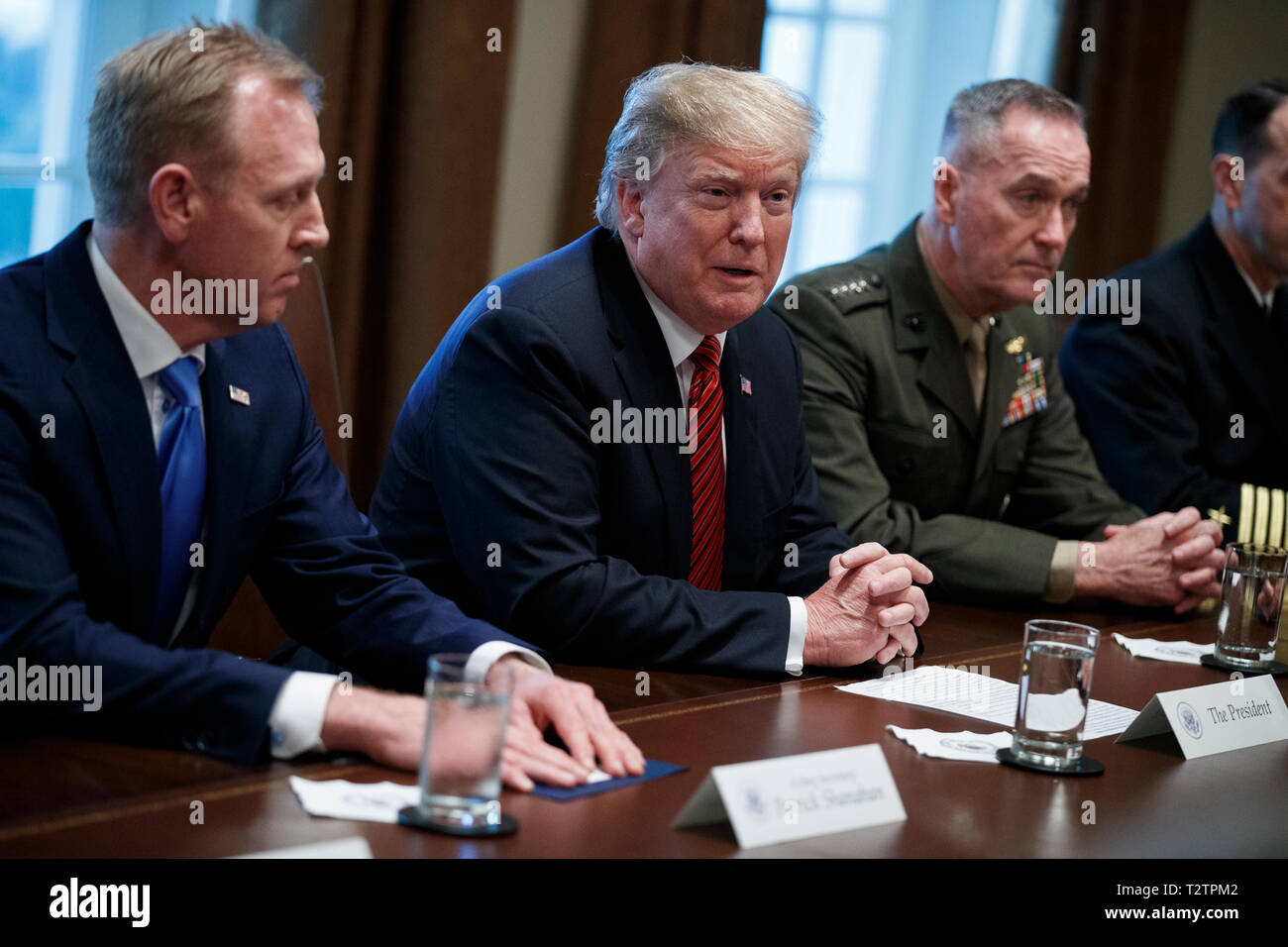 Washington, DC, USA. 03rd Apr, 2019. US President Donald J. Trump (C), with Acting Secretary of Defense Patrick Shanahan (L) and Chairman of the Joint Chiefs of Staff General Joseph Dunford (R), delivers remarks during a briefing by senior military leaders in the Cabinet Room of the White House in Washington, DC, USA, 03 April 2019. Following the briefing President Trump will host a dinner for the officials. Credit: Shawn Thew/Pool via CNP | usage worldwide Credit: dpa/Alamy Live News Stock Photo