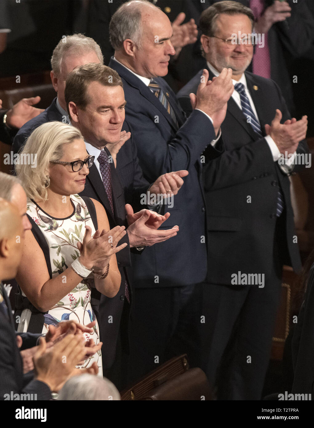Washington, District of Columbia, USA. 3rd Apr, 2019. From left to right: United States Senator Kyrsten Sinema (Democrat of Arizona), US Senator Michael F. Bennet (Democrat of Colorado), US Senator Bob Casey, Jr. (Democrat of Pennsylvania), and US Senator Gary Peters (Democrat of Michigan) applaud as Jens Stoltenberg, Secretary General of the North Atlantic Treaty Organization (NATO) arrives to address a joint session of the United States Congress in the US Capitol in Washington, DC on Wednesday, April 3, 2019 Credit: Ron Sachs/CNP/ZUMA Wire/Alamy Live News Stock Photo