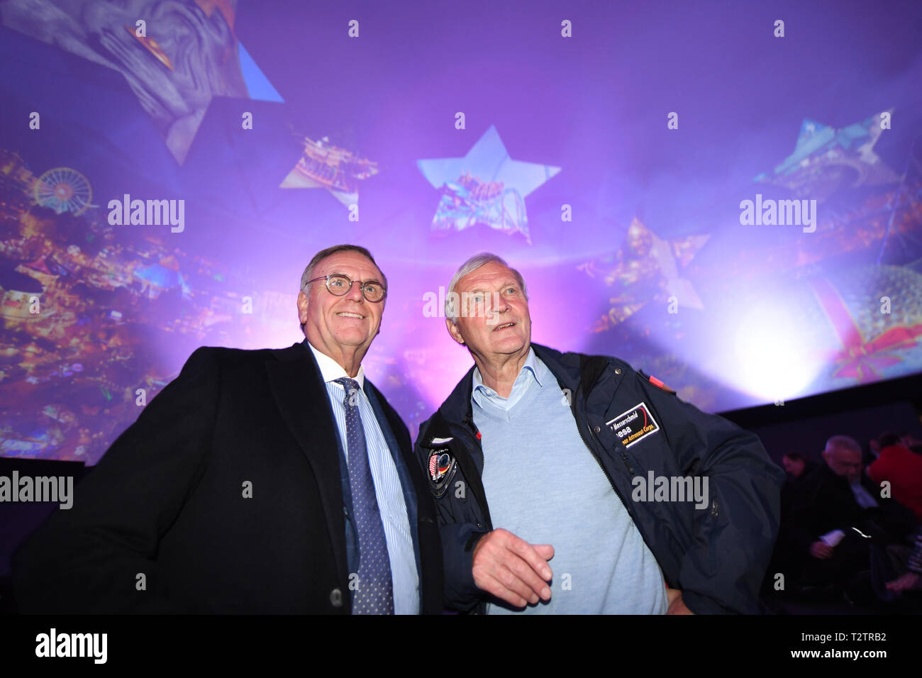 Rust, Germany. 04th Apr, 2018. Roland Mack (l), Managing Director of Europa-Park, and astronaut Ernst Messerschmid (r) stand in the Dreamtime Dome and watch the film 'Mission Astronaut'. In the 360 degree dome the astronaut film is shown. Europa-Park is Germany's largest amusement park. Credit: Patrick Seeger/dpa/Alamy Live News Stock Photo