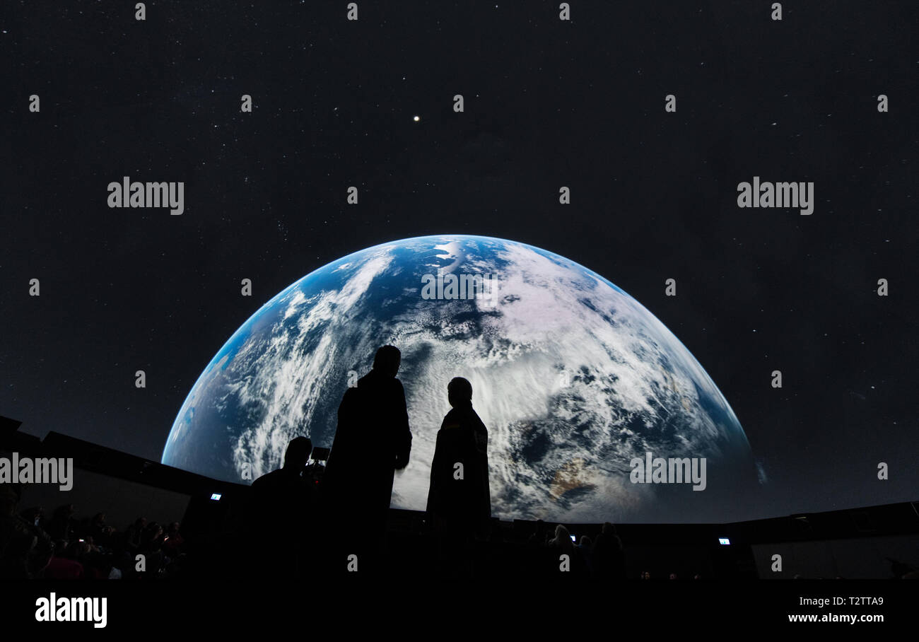 Rust, Germany. 04th Apr, 2018. Roland Mack (l), Managing Director of Europa-Park, and astronaut Ernst Messerschmid (r) stand in the Dreamtime Dome and watch the film 'Mission Astronaut'. In the 360 degree dome the astronaut film is shown. Europa-Park is Germany's largest amusement park. Credit: Patrick Seeger/dpa/Alamy Live News Stock Photo