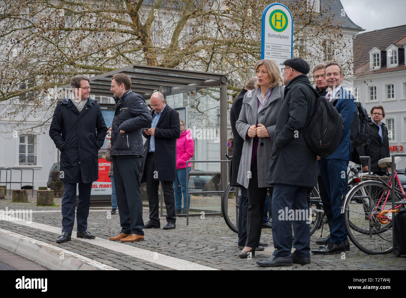 04 April 2019, Saarland, Saarbrücken: Federal Transport Minister Andreas Scheuer (CSU, l) is standing at a bus stop together with Hans Reichhart (CSU), Bavarian State Minister for Housing, Construction and Transport, and other participants of the Conference of Transport Ministers. The transport ministers are currently meeting under the chairmanship of the Saarland. Photo: Oliver Dietze/dpa Stock Photo