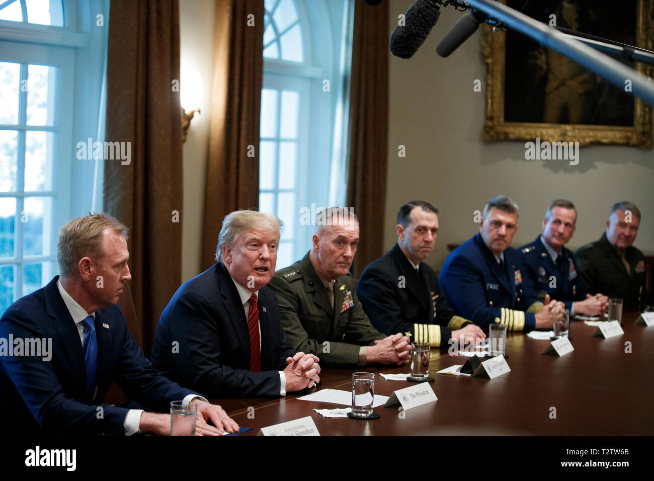 US President Donald J. Trump (L-2), with Acting Secretary of Defense Patrick Shanahan (L) and Chairman of the Joint Chiefs of Staff General Joseph Dunford (L-3), delivers remarks during a briefing by senior military leaders in the Cabinet Room of the White House in Washington, DC, USA, 03 April 2019. Following the briefing President Trump will host a dinner for the officials. Credit: Shawn Thew/Pool via CNP /MediaPunch Stock Photo