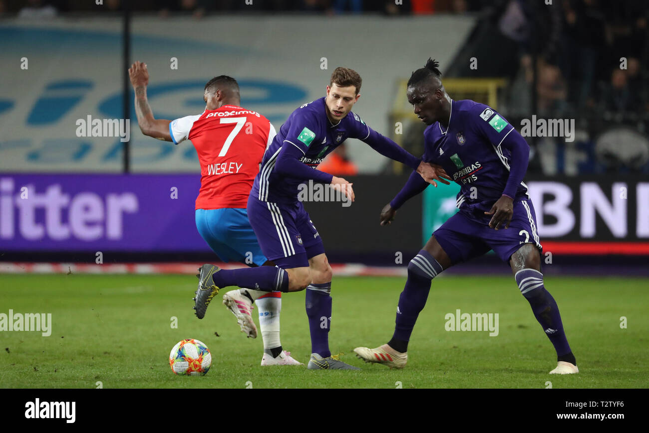 BRUSSELS, BELGIUM - APRIL 04: Wesley Moraes of Club Brugge, James Lawrence  of Anderlecht and Kara Mbodji of Anderlecht fight for the ball during the  Jupiler Pro League play-off 1 match (day