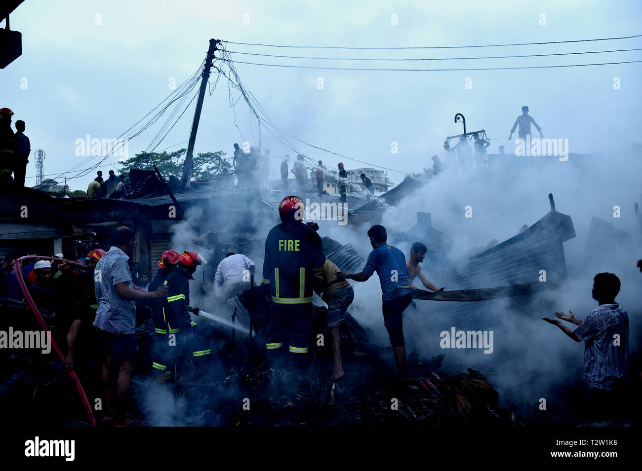 Beijing, Bangladesh. 4th Apr, 2019. Smoke billows after a fire broke out at a kitchen market in Dhaka, Bangladesh, April 4, 2019. An early morning fire gutted dozens of shops in a kitchen market in Bangladesh capital Dhaka on Thursday, Kazi Nazmuzzaman, deputy assistant director of Fire Service and Civil Defense, told Xinhua. Credit: Stringer/Xinhua/Alamy Live News Stock Photo