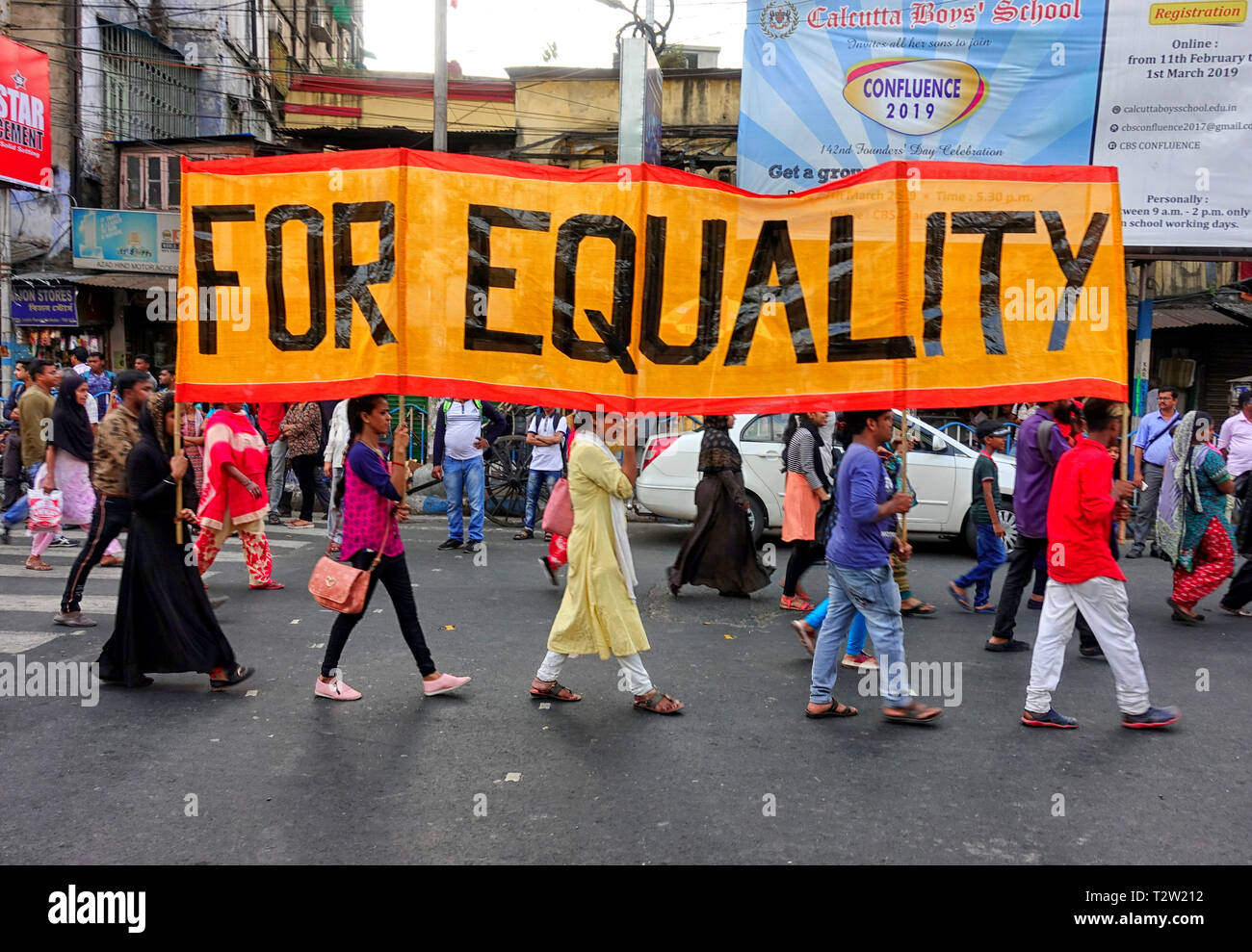 Various Woman & Trans person's activist seen carrying a big banner with a demand to create Equality in the society during the Walk for Equality & Freedom before the Election of India at Kolkata. Activist raise specific demands to vote for Democracy, Harmony & Justice and ask their supporters to choose the candidate who will fight against War, Violence and Fascism. Stock Photo