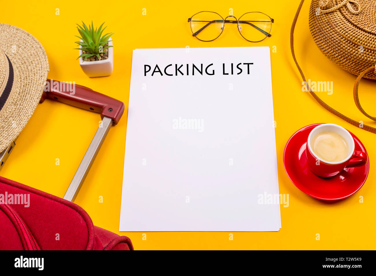 The Packing List For The Trip Is Next To A Suitcase A Cup Of Coffee And The Packing List For The Trip Is Next To A Suitcase A Cup Of Coffee And