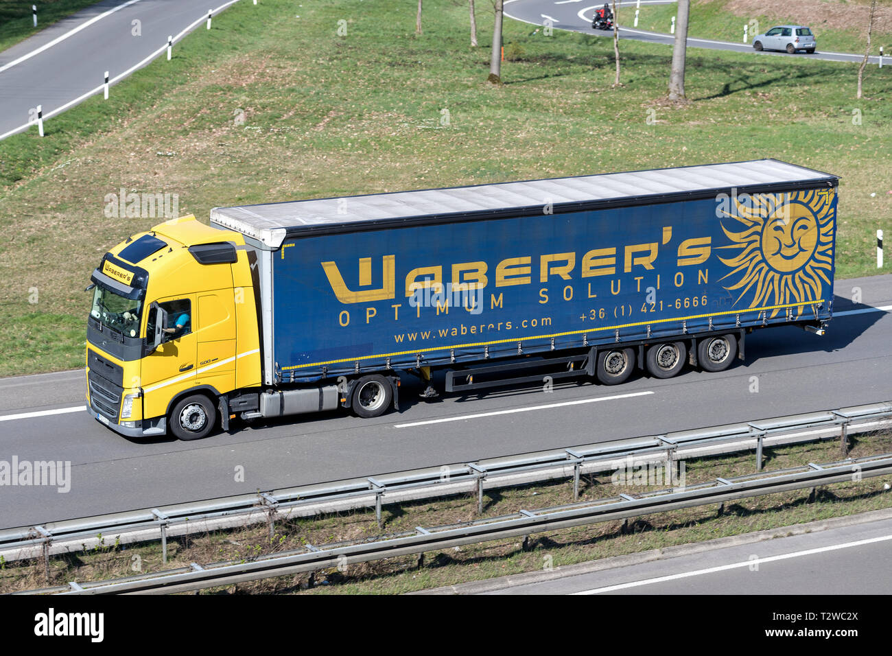 Waberer’s truck on motorway. With a fleet of over 4,300 trucks and around 7,600 employees, Waberer’s serves customers across 28 countries in Europe. Stock Photo