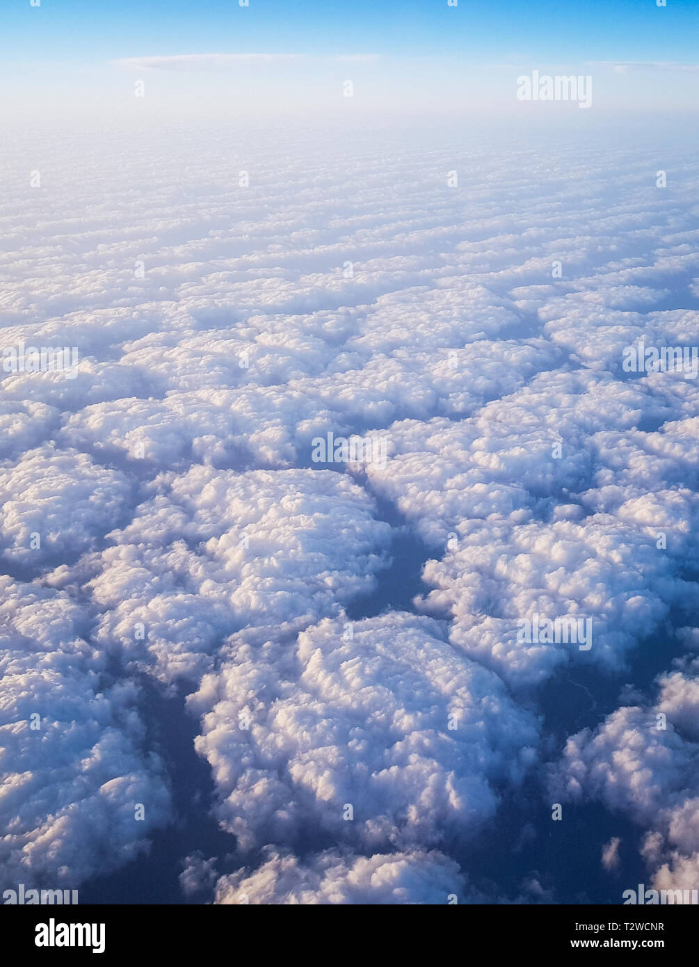 Clouds seen from above from an airplane cabin Stock Photo