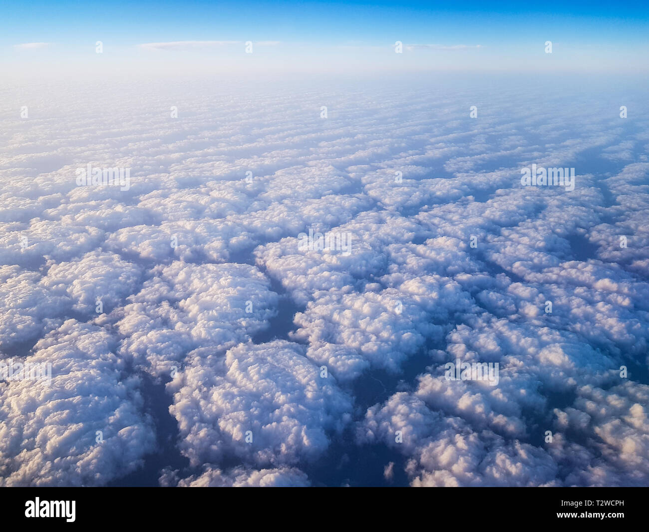 Clouds seen from above from an airplane cabin Stock Photo