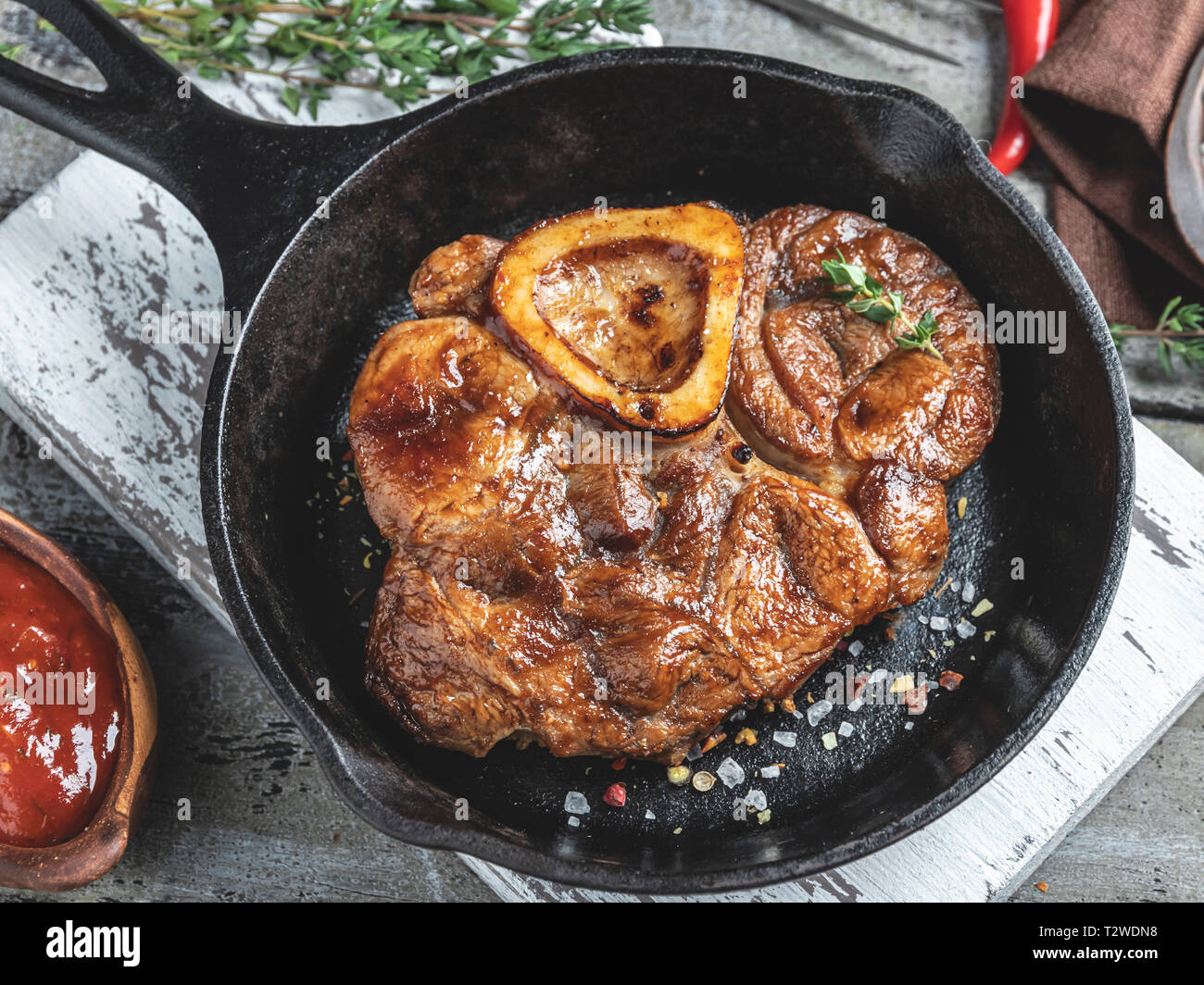 Osso buco cooked veal shank on a portion board closeup Stock Photo