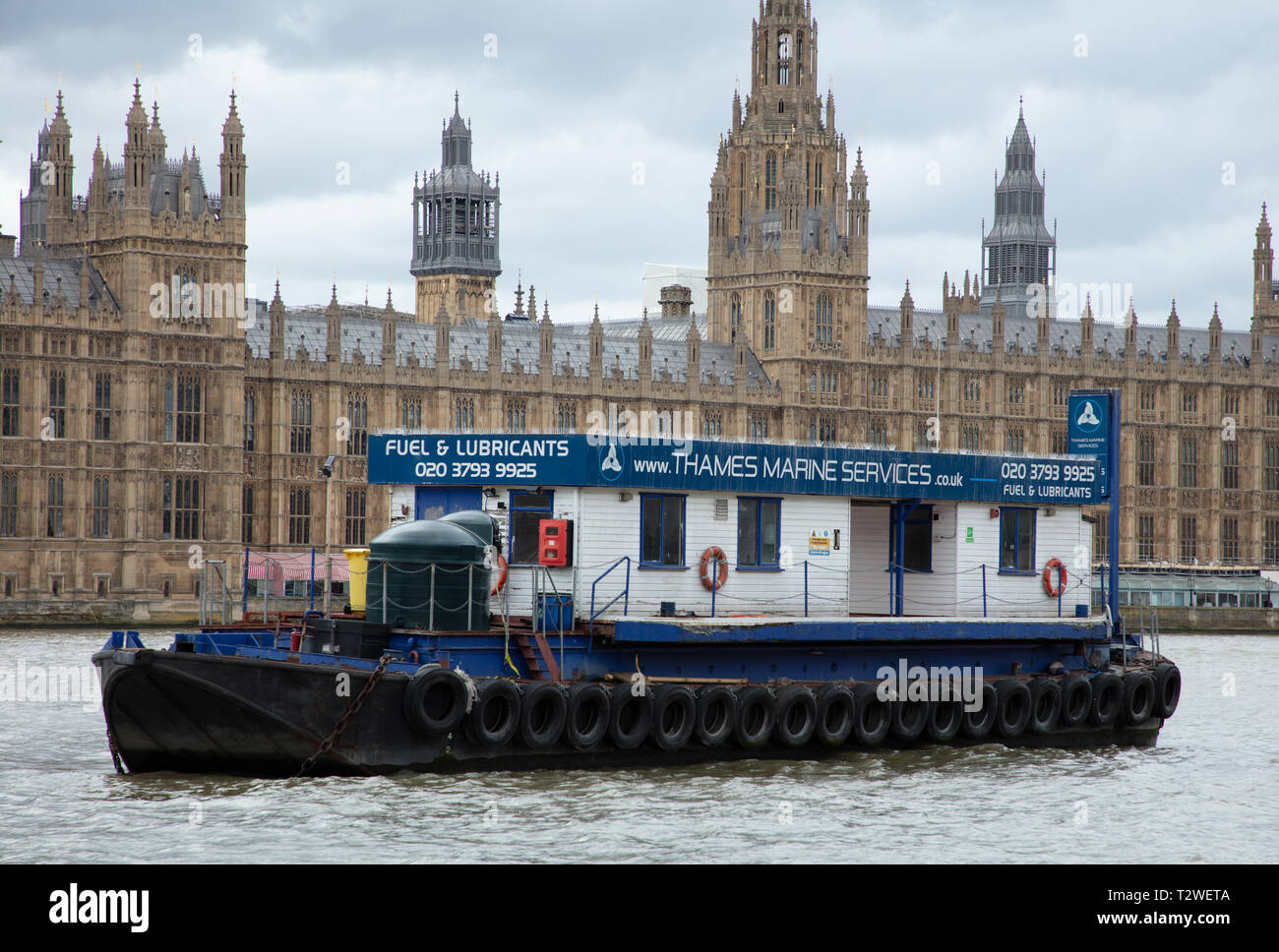https://c8.alamy.com/comp/T2WETA/large-service-boat-supplies-fuel-and-lubricants-to-vessels-navigating-the-river-thames-is-permanently-moored-near-parliament-westminster-london-T2WETA.jpg