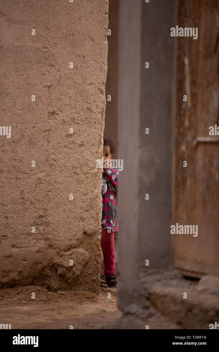 Moroccan girl peeking Stock Photo