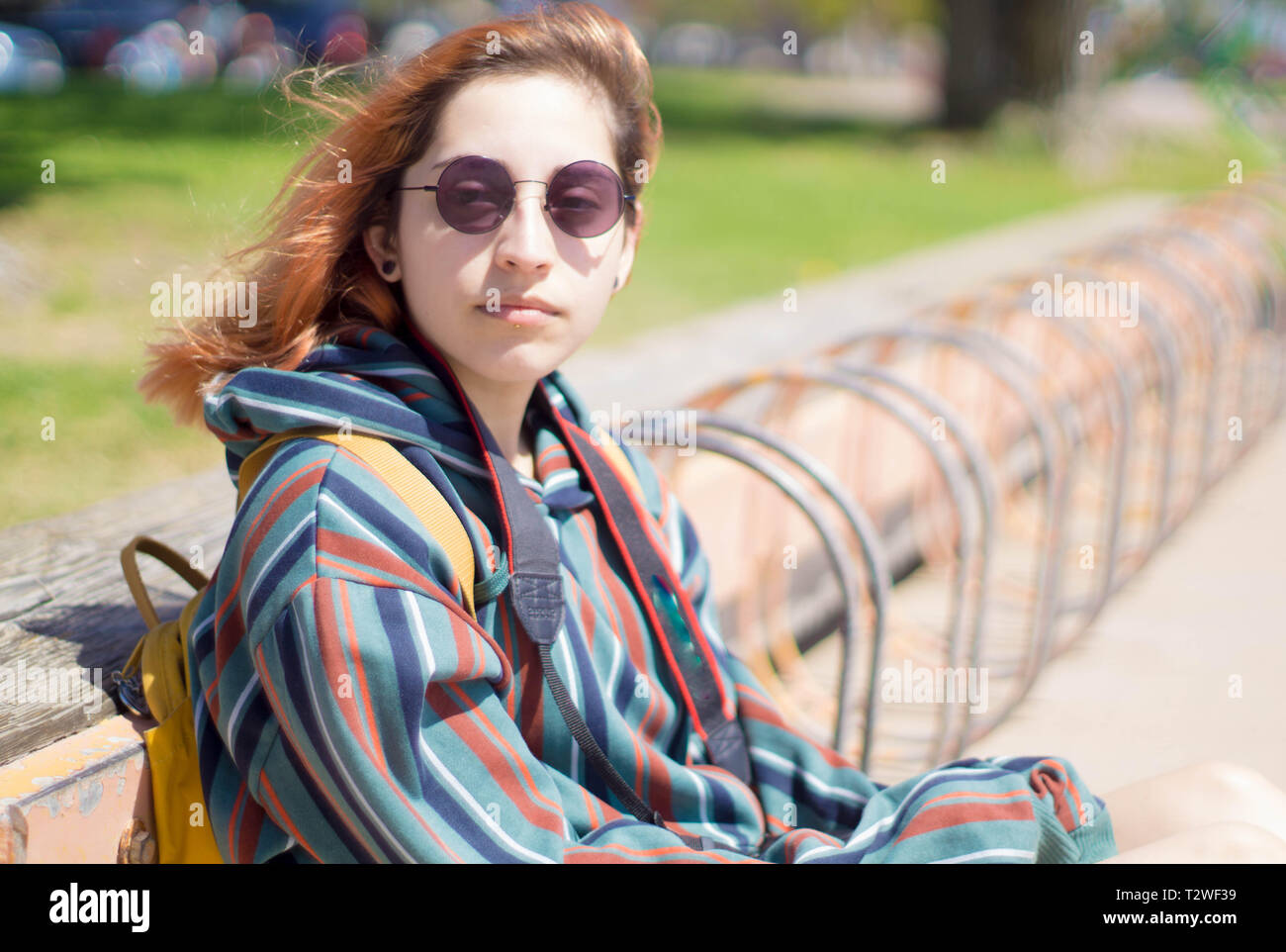 wind blowing against hip sitting model Stock Photo - Alamy