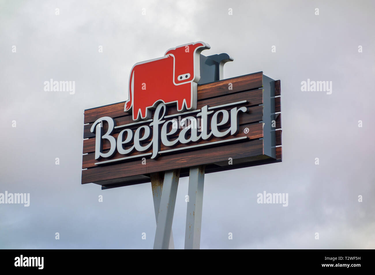 Beefeater restaurant logo sign against a grey sky background Stock