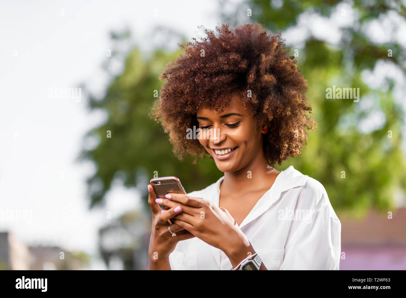 Outdoor portrait of a Young black African American young woman speaking ...