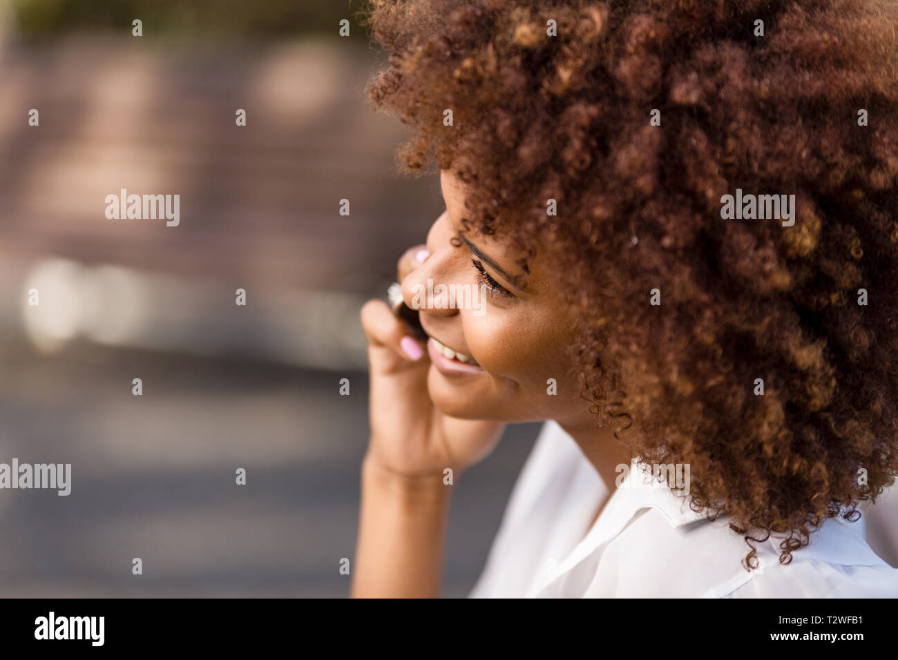 Outdoor portrait of a Young black African American young woman speaking ...
