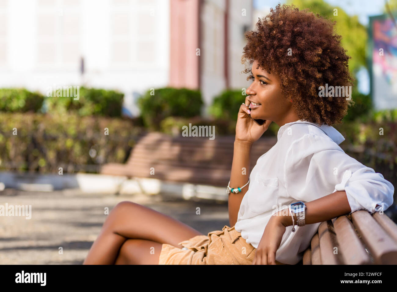 Outdoor portrait of a Young black African American young woman speaking ...