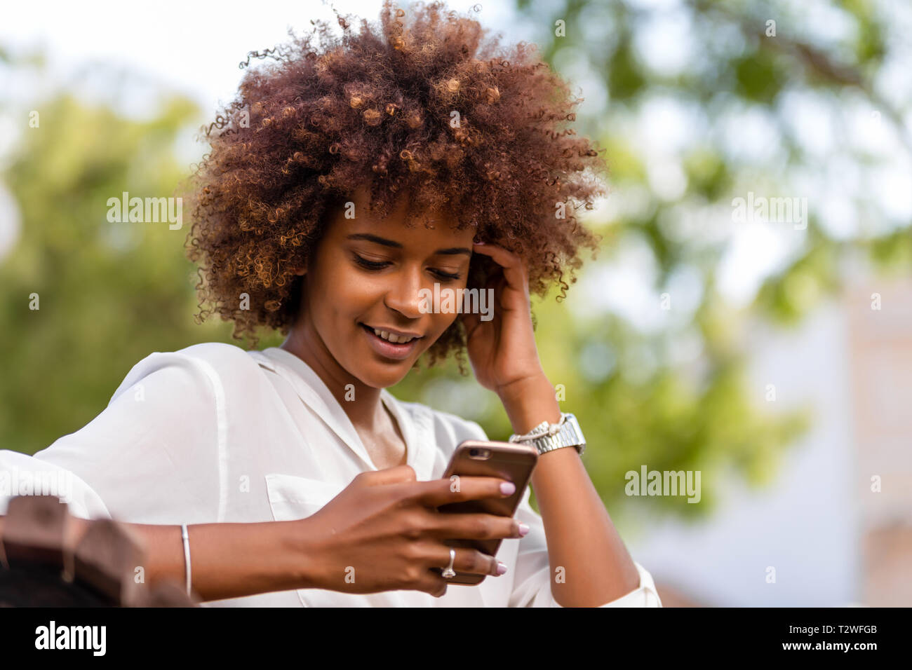 Outdoor portrait of a Young black African American young woman speaking ...