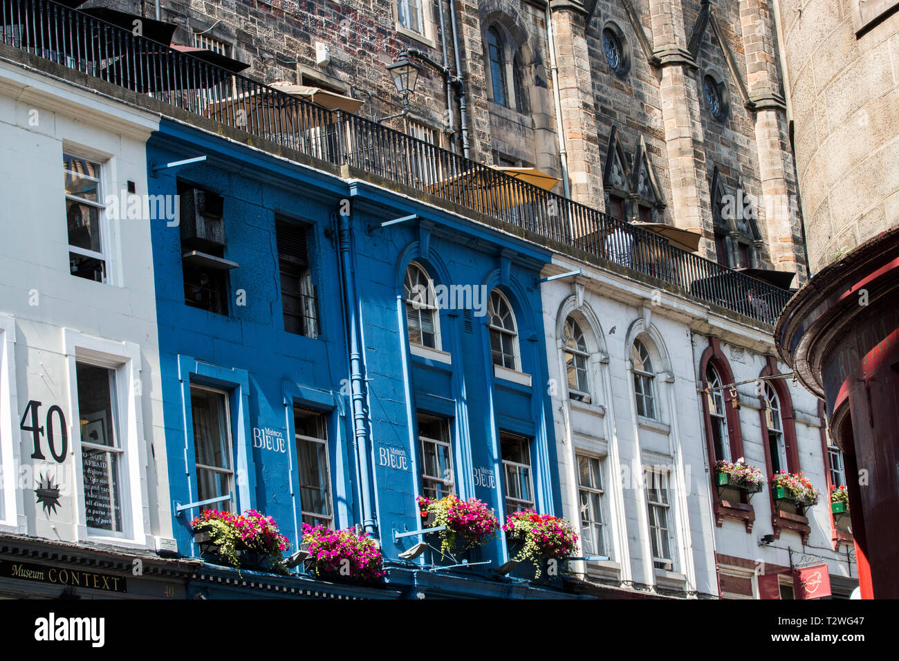 colorful street in Edinburgh beneath the cathedral. Stock Photo