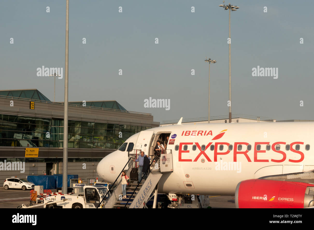 Dublin Airport Iberia Express Airbus A320 jet plane and passengers Stock Photo