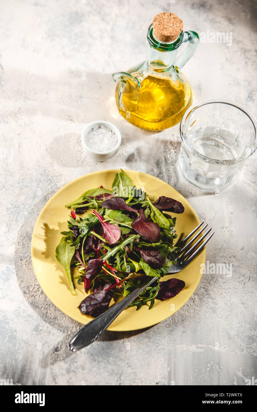 Fresh salad mix of baby spinach, arugula leaves and chard in green