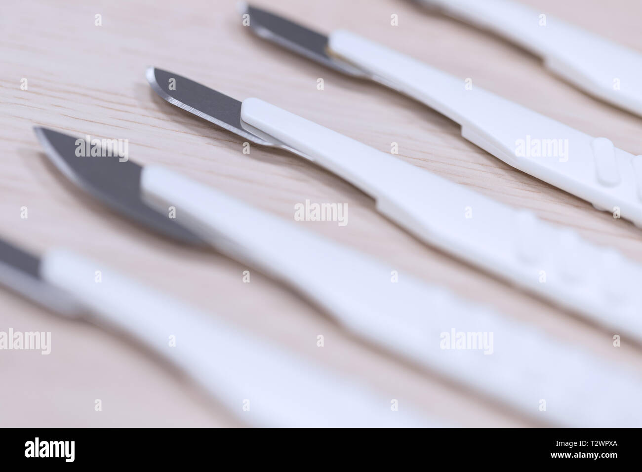 many medical scalpels background Stock Photo Alamy