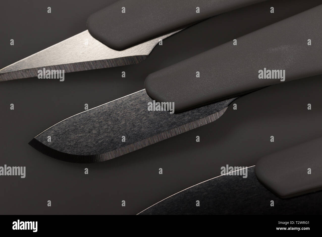 medical scalpels shadow background Stock Photo Alamy