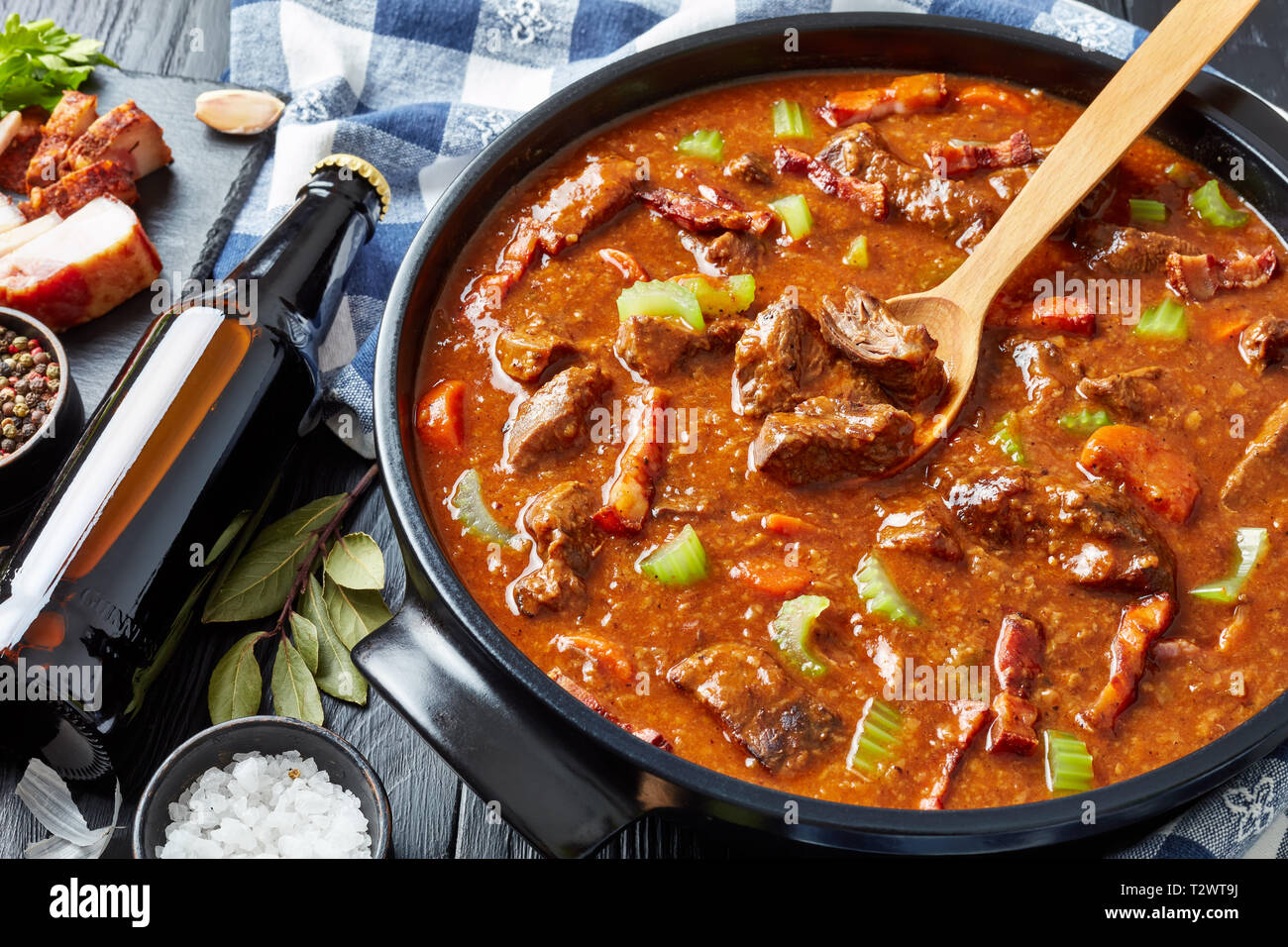 classic irish beef and beer stew with carrots, bacon, celery stalk