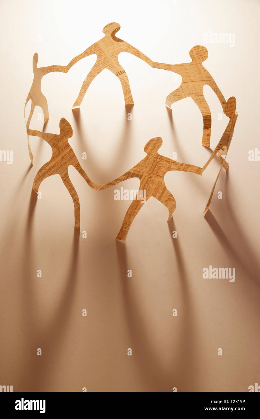 Paper dolls holding hands hires stock photography and images Alamy