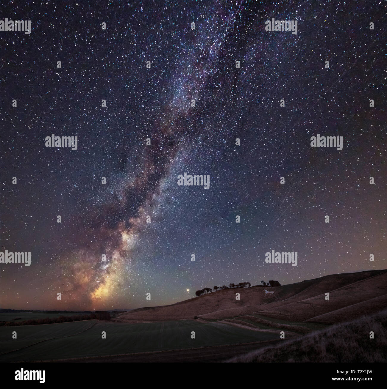Stunning vibrant Milky Way composite image over landscape of ancient ...