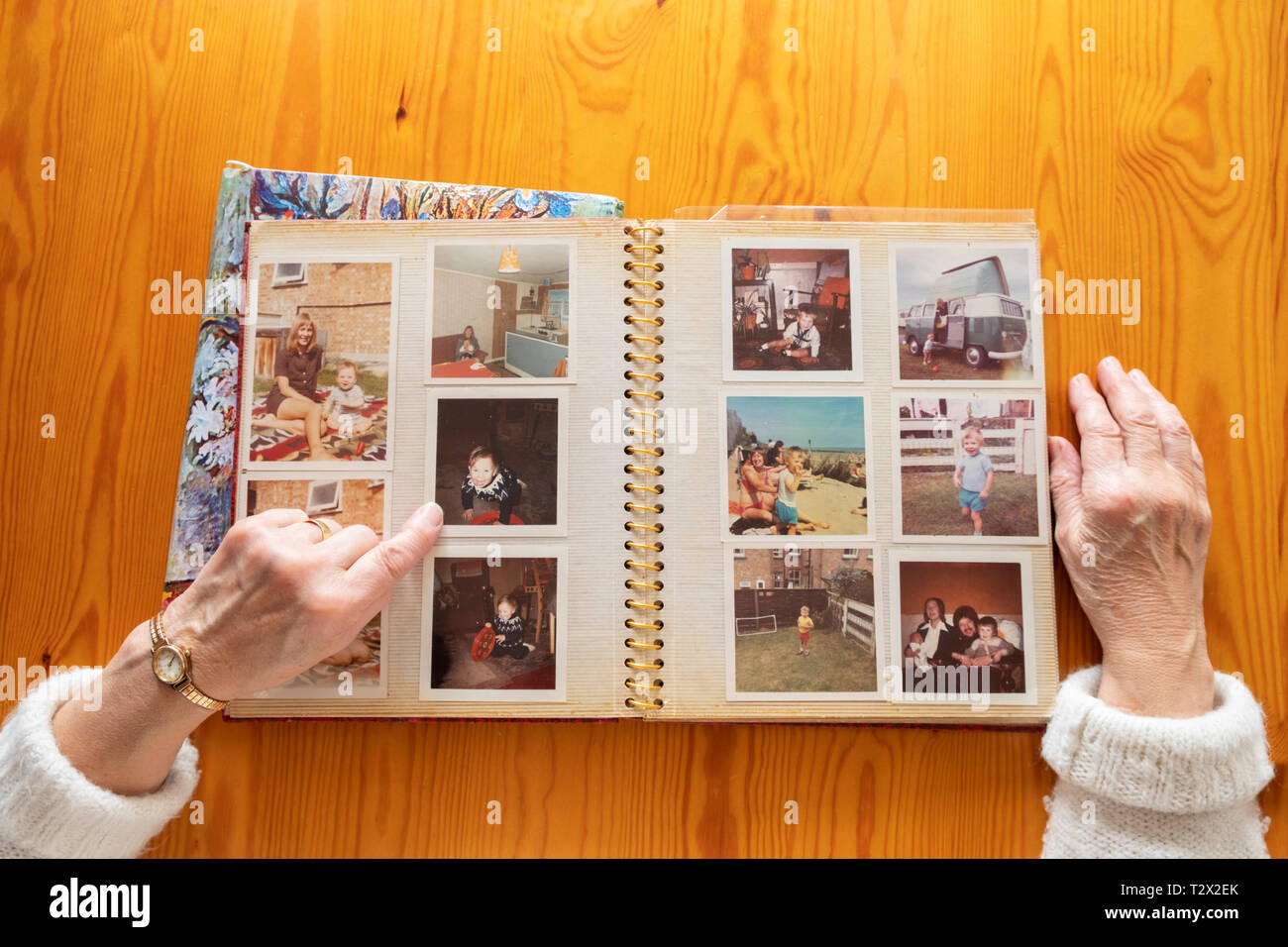 Top view of a senior caucasian woman looking at an old photo album Stock Photo