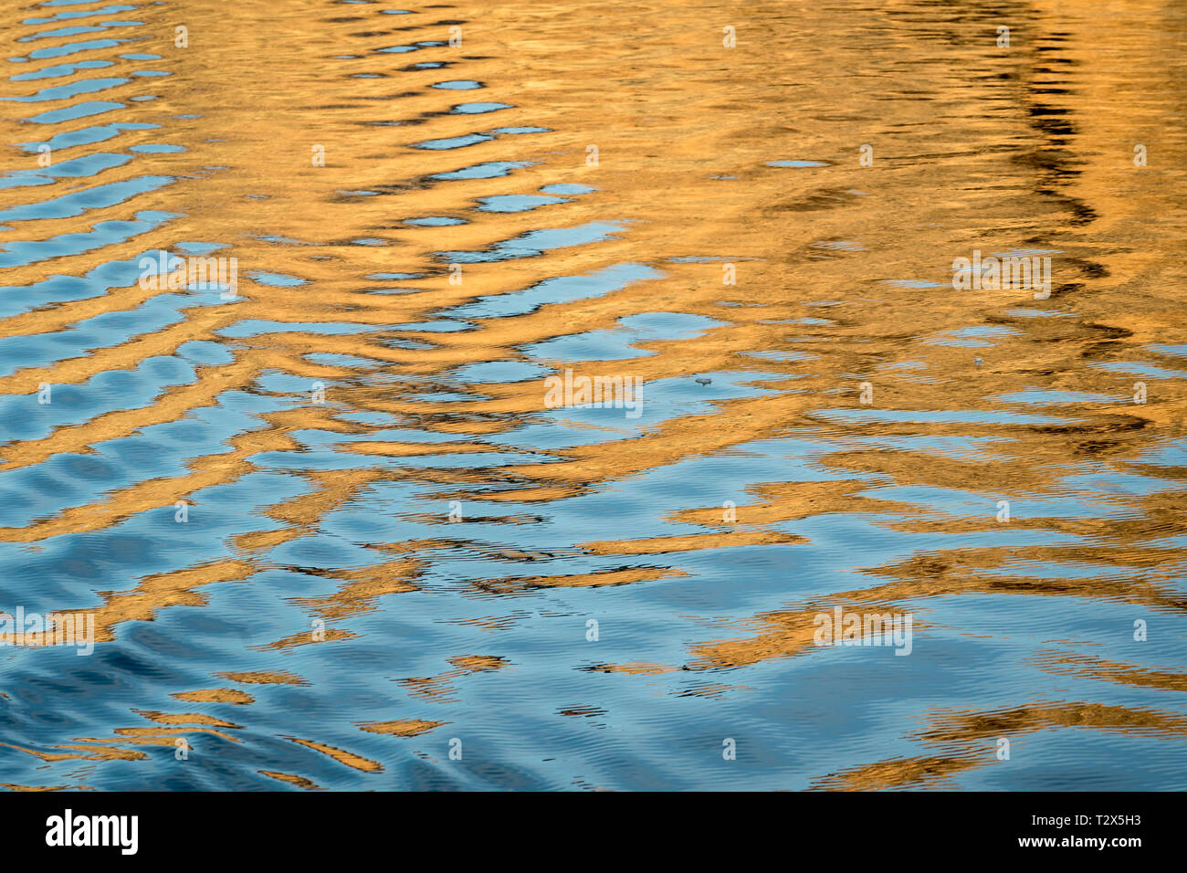 Sunset and water patterns, Scoresbysund, Greenland Stock Photo