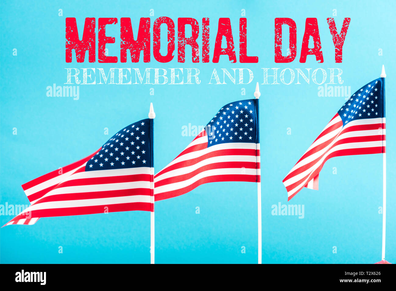 american flags with memorial day lettering on blue Stock Photo - Alamy