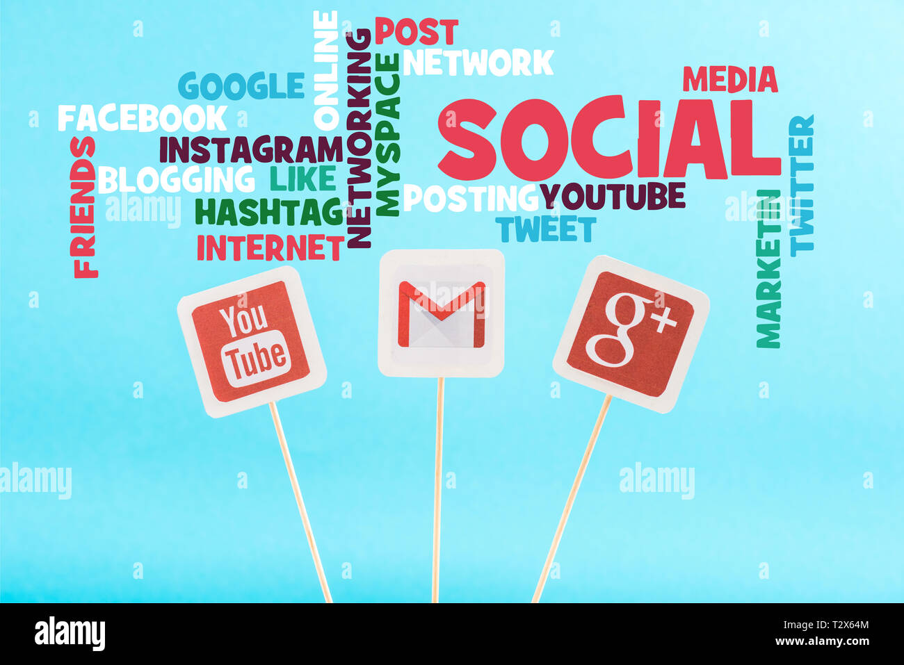 social media words and cards with youtube, gmail and google plus logo isolated on blue Stock Photo