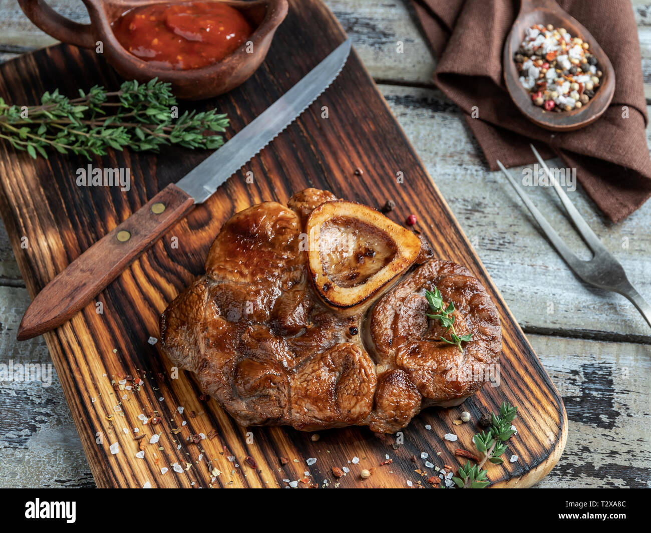 Osso buco cooked Veal shank on a portion board closeup Stock Photo Alamy