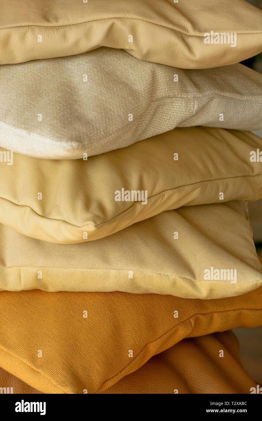 Beige decorative pillows made from real leather Stock Photo