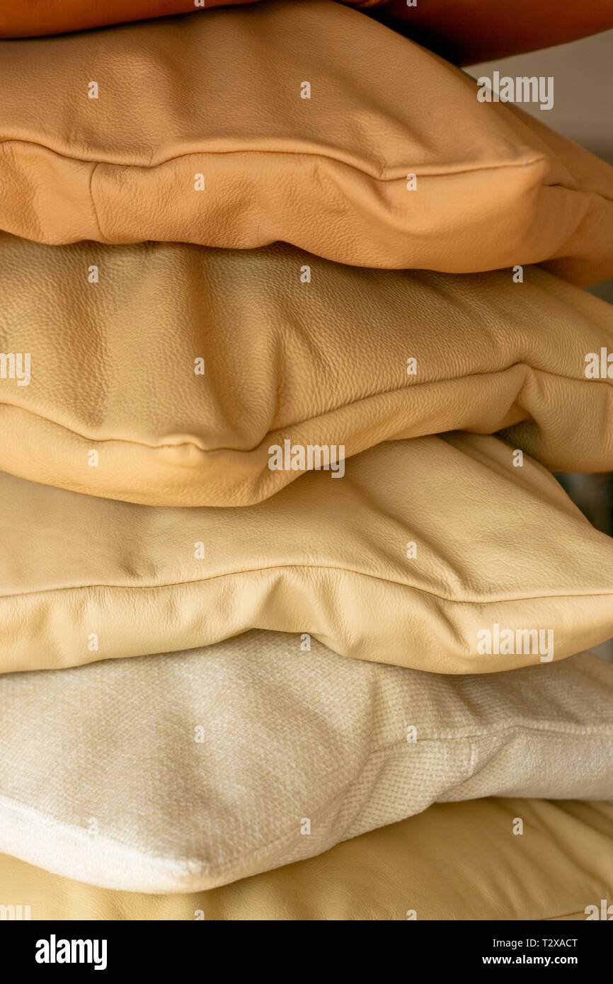 Ochre decorative pillows made from real leather Stock Photo